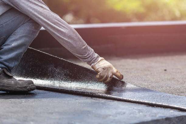Professional Basement Waterproofing technician working in Montague, MI
